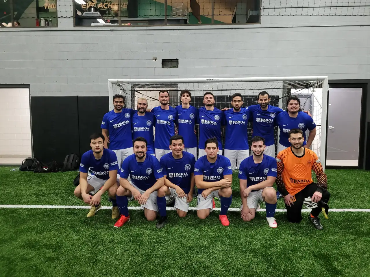 Waterloo City FC squad in the blue kit before an indoor match